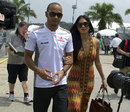 Pole-sitter Lewis Hamilton arrives at the circuit with his girlfriend Nicole Scherzinger
