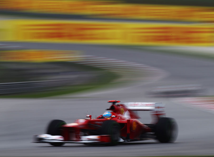 Fernando Alonso leads as the track dries out