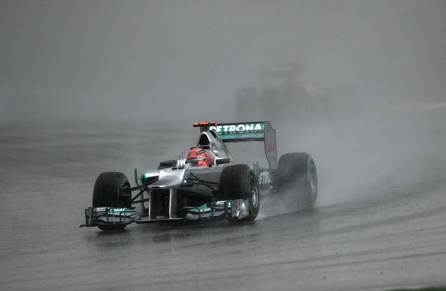 Michael Schumacher recovers after an early spin