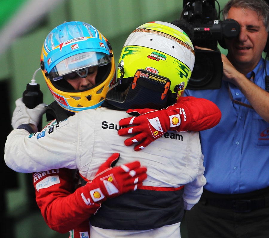 Fernando Alonso and Sergio Perez congratulate each other in parc ferme