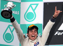 Sergio Perez celebrates on the podium
