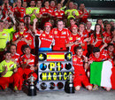 Fernando Alonso celebrates victory with his Ferrari team