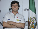 Sergio Perez poses for a photo at a press conference