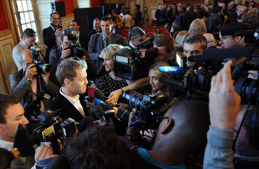 Sebastian Vettel talks to the media after receiving yet another award for his 2011 season