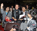 Micheal Schumacher is greeted by fans at the airport upon his arrival ahead of the Chinese Grand Prix