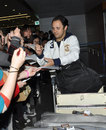 Felipe Massa signs autographs at the airport upon his arrival ahead of the Chinese Grand Prix