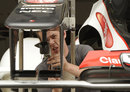 A Sauber mechanic at work on Kamui Kobayashi's car in the paddock on Wednesday