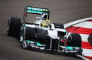 Nico Rosberg clips the apex in his Mercedes