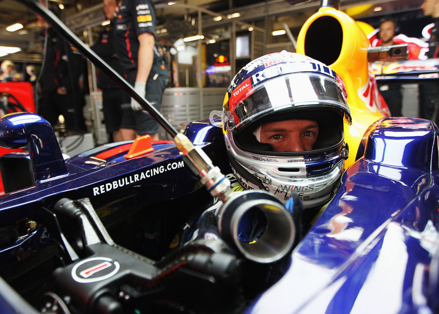 Sebastian Vettel in the cockpit of his Red Bull ahead of a free practice run