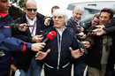 Bernie Ecclestone talks to journalists in the paddock