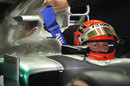 Michael Schumacher waits in his Mercedes in the garage