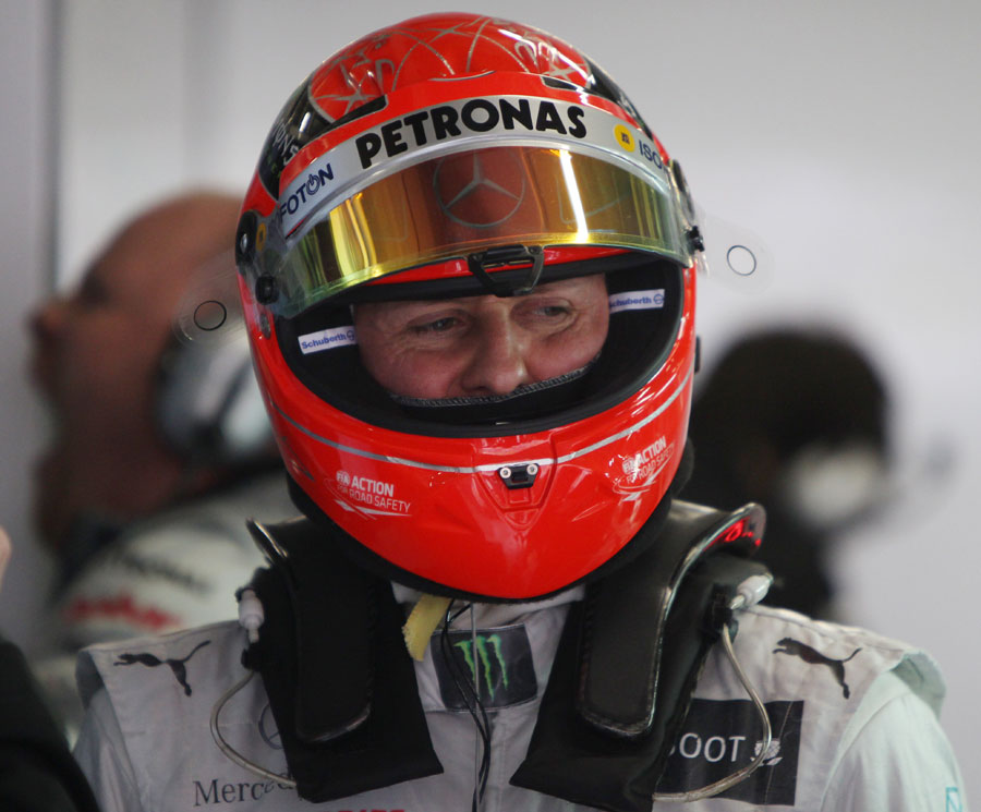 Michael Schumacher in the Mercedes garage during Friday practice
