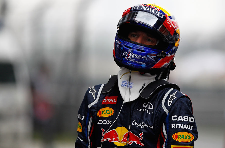 Mark Webber walks towards the FIA's weigh-room