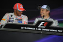 Lewis Hamilton and Nico Rosberg share a joke in the post-qualifying press conference