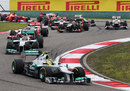 Nico Rosberg leads the pack through the first two corners
