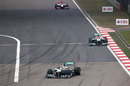 Nico Rosberg leads Michael Schumacher in to turn one