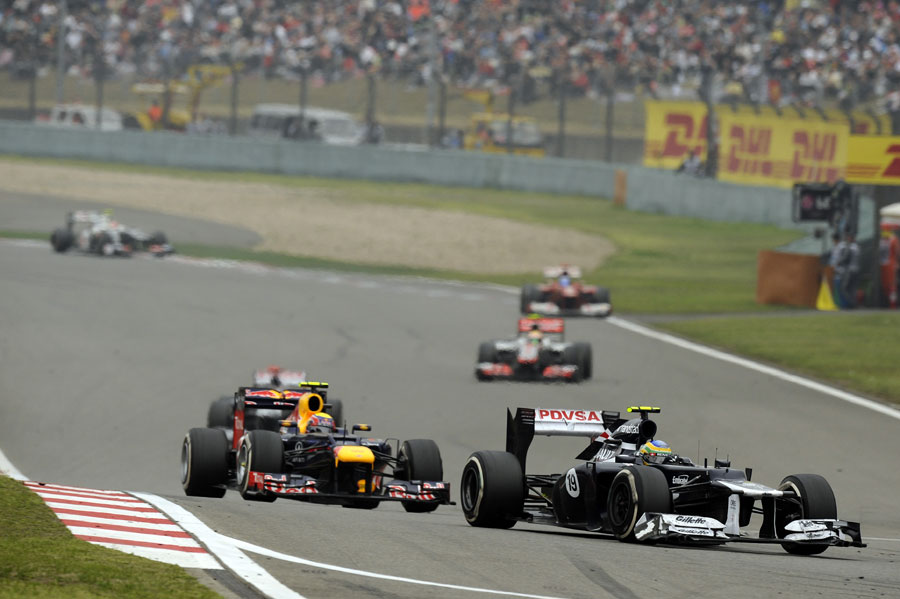 Bruno Senna leads Mark Webber in to the final corner