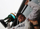 Nico Rosberg celebrates his first F1 victory with his mechanics
