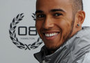 Lewis Hamilton smiles in the McLaren garage