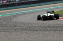Nico Rosberg keeps clear of the marbles on the outside of the track