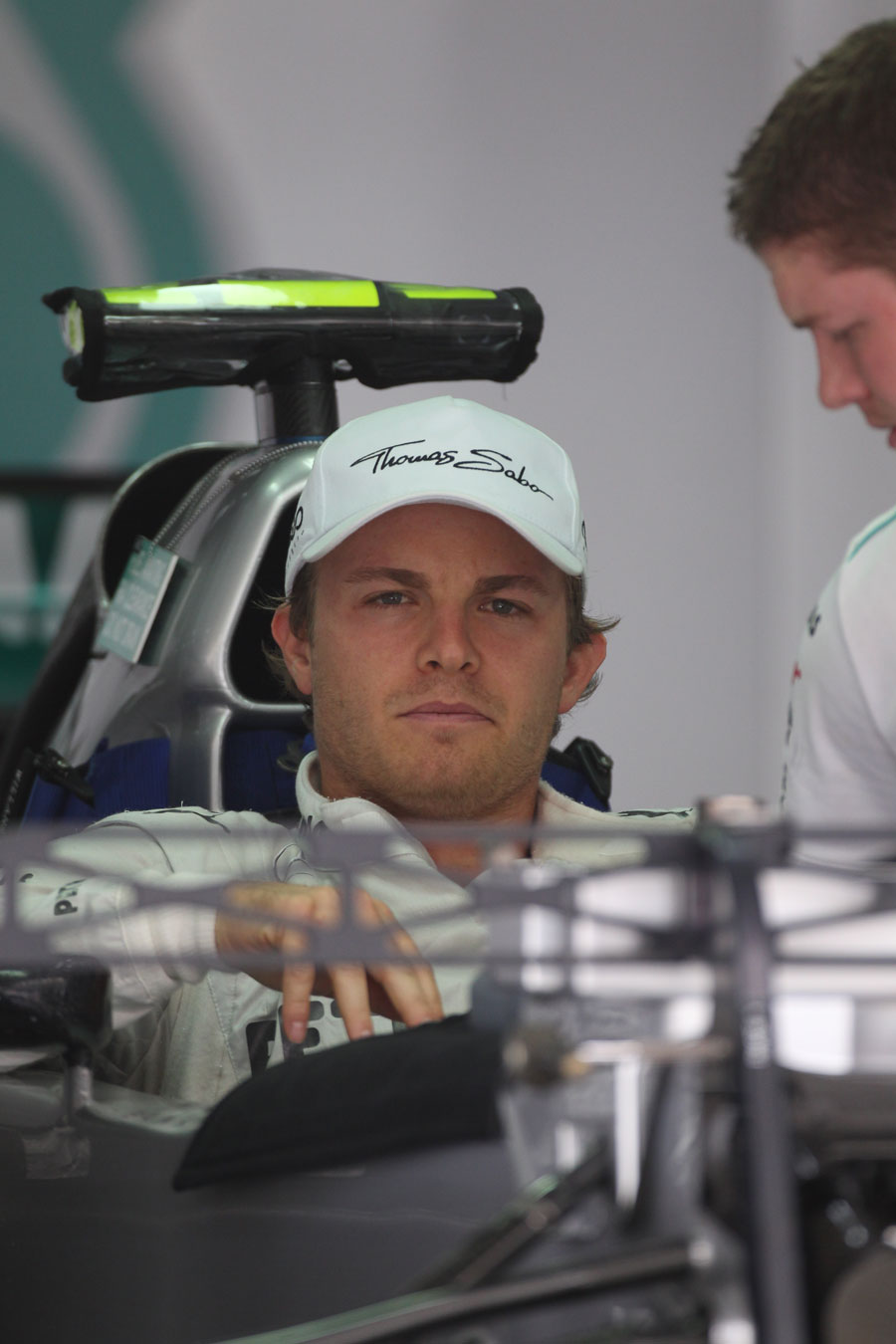 Nico Rosberg gets to work in the Mercedes garage