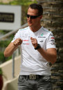 Michael Schumacher gets very expressive in the paddock on Thursday