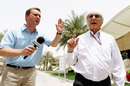 Bernie Ecclestone conducts a brief interview in the paddock