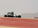 Nico Rosberg crests the brow of a hill during practice