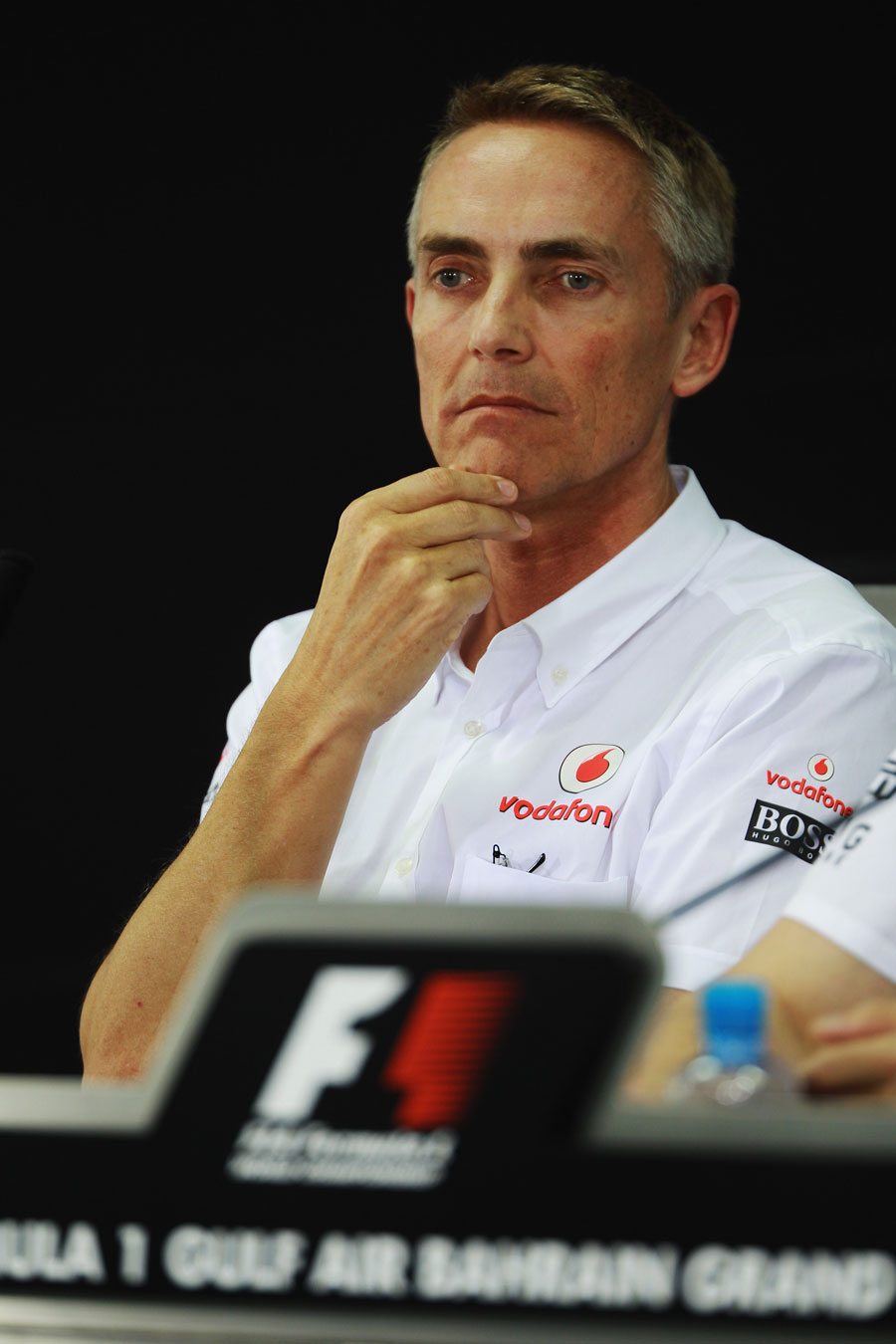 Martin Whitmarsh stares in to the middle distance during the FIA press conference on Friday