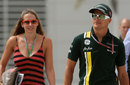 Heikki Kovalainen arrives in the paddock with his girlfriend Catherine Hyde