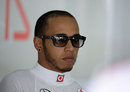 Lewis Hamilton relaxes at the back of the garage 