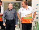 FIA president Jean Todt and Force India deputy team principal Bob Fernley walk into the paddock