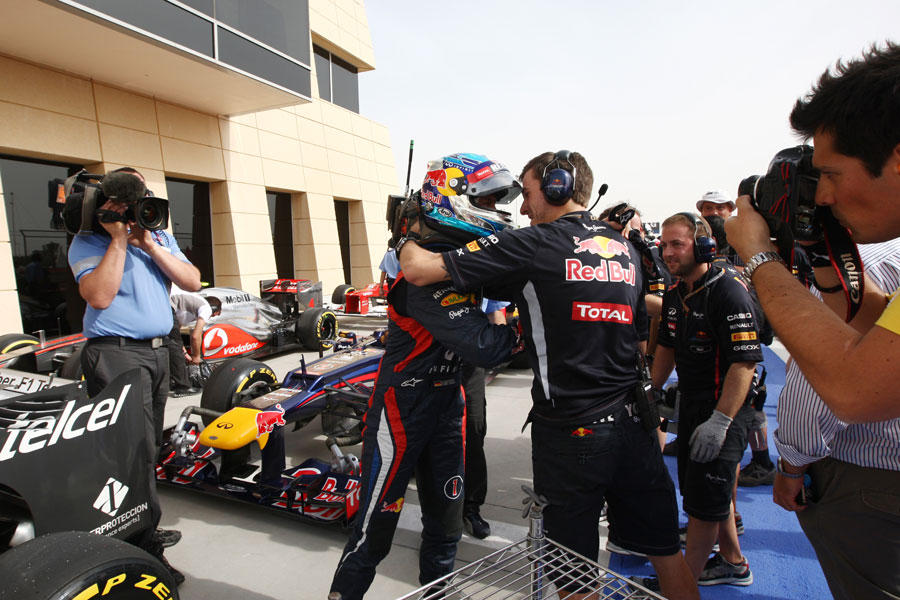 Sebastian Vettel celebrates his first pole position of the season with his team