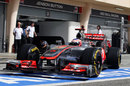 Jenson Button leaves the McLaren garage