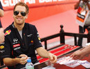 Sebastian Vettel signs autographs on race day morning