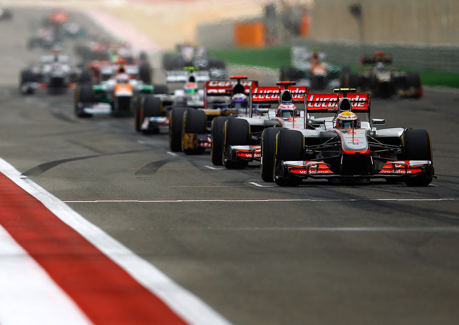The McLarens line up on the dirty side of the grid
