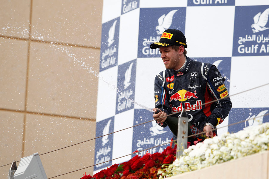Sebastian Vettel celebrates on the podium 