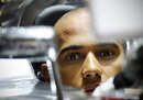 Lewis Hamilton in the cockpit of his McLaren ahead of the session