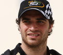 Lotus test driver Jerome d'Ambrosio arrives in the paddock