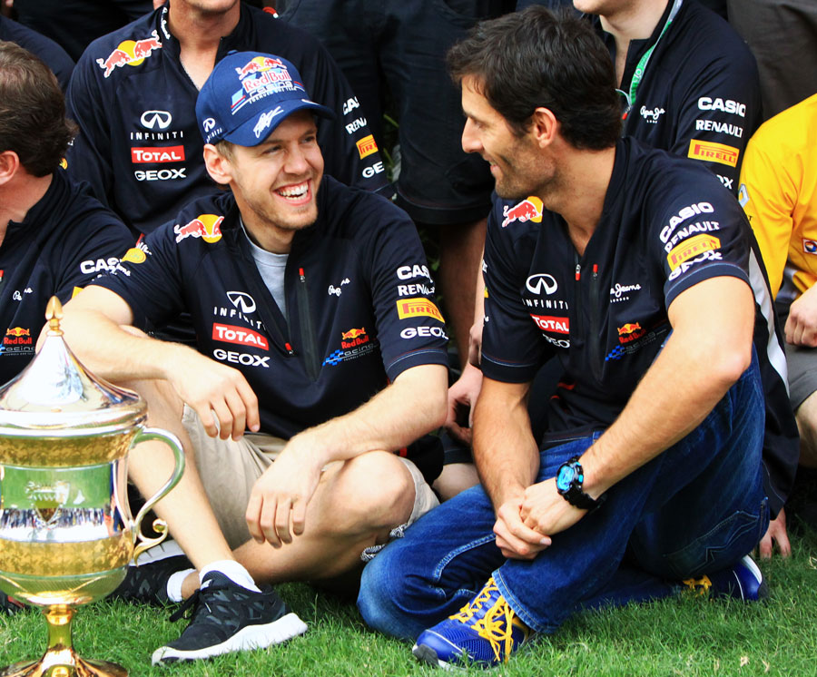 Sebastian Vettel enjoys a joke with his team-mate Mark Webber after winning the race