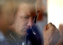 Christian Horner monitors his drivers' progress from the pit  wall