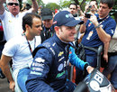 Felipe Massa hitches a ride with old friend Rubens Barrichello in the IndyCar paddock