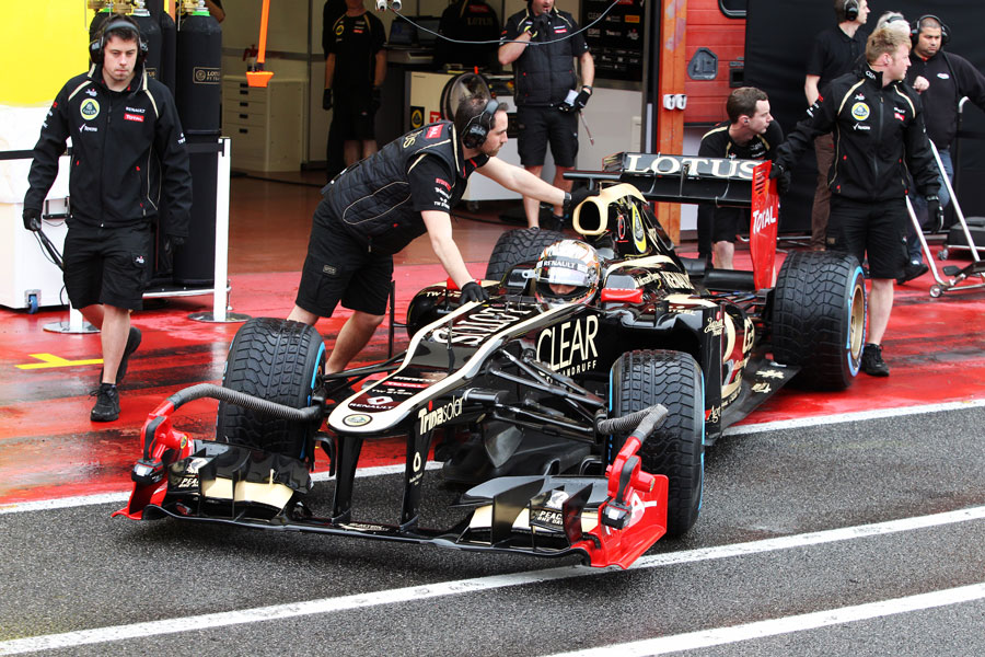 Lotus mechanics wheel Jerome d'Ambrosio back into the garage