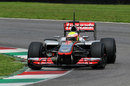 Oliver Turvey attacks the apex in the McLaren