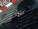 Jenson Button performs a burnout in front of Hungarian fans