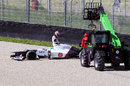 Kamui Kobayashi causes a red flag after beaching his Sauber in the gravel
