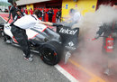Sauber mechanics deal with a flash fire in the pit lane