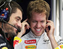 Sebastian Vettel shares a joke with his race engineer Guillaume Rocquelin