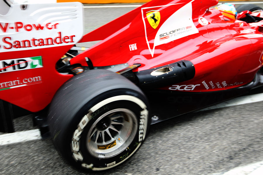 Fernando Alonso leaves the garage in the updated Ferrari
