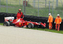 Fernando Alonso's updated Ferrari in the barriers after an accident in the morning